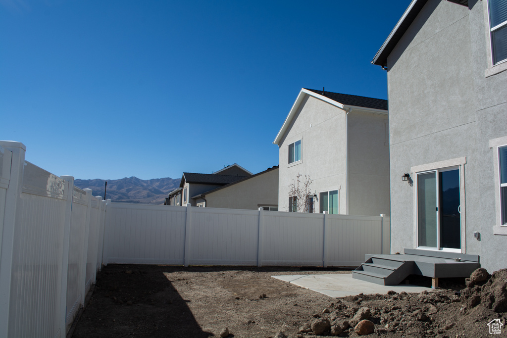 The vinyl fence is in place so you can enjoy privacy and keep your dog happy. Top soil was brought in and spread to give grass a boost when you are ready and if you decide to put it in. There is extra for garden beds, too.