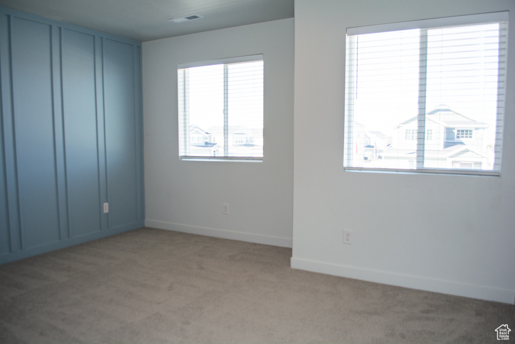 Lastly, bedroom 3 has a unique custom designed wood wall as well. This home definitely doesn't feel cookie cutter!