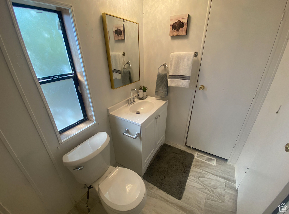 Bathroom featuring toilet and vanity