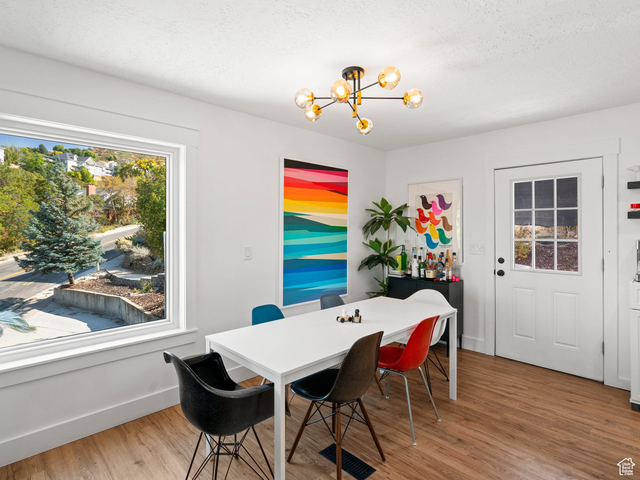 Dining room featuring wood-type flooring, and an inviting chandelier