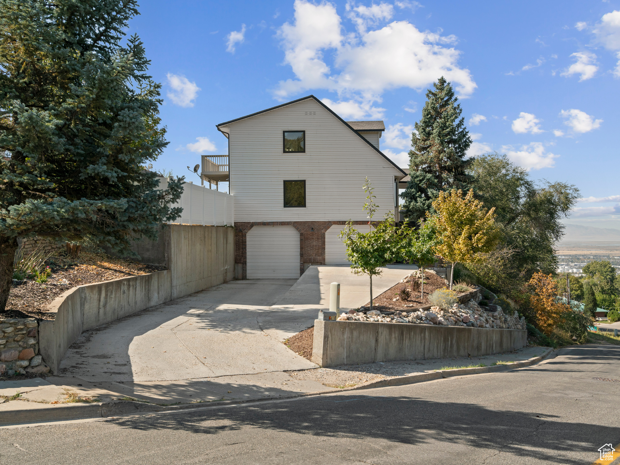 View of property with a 2 car garage