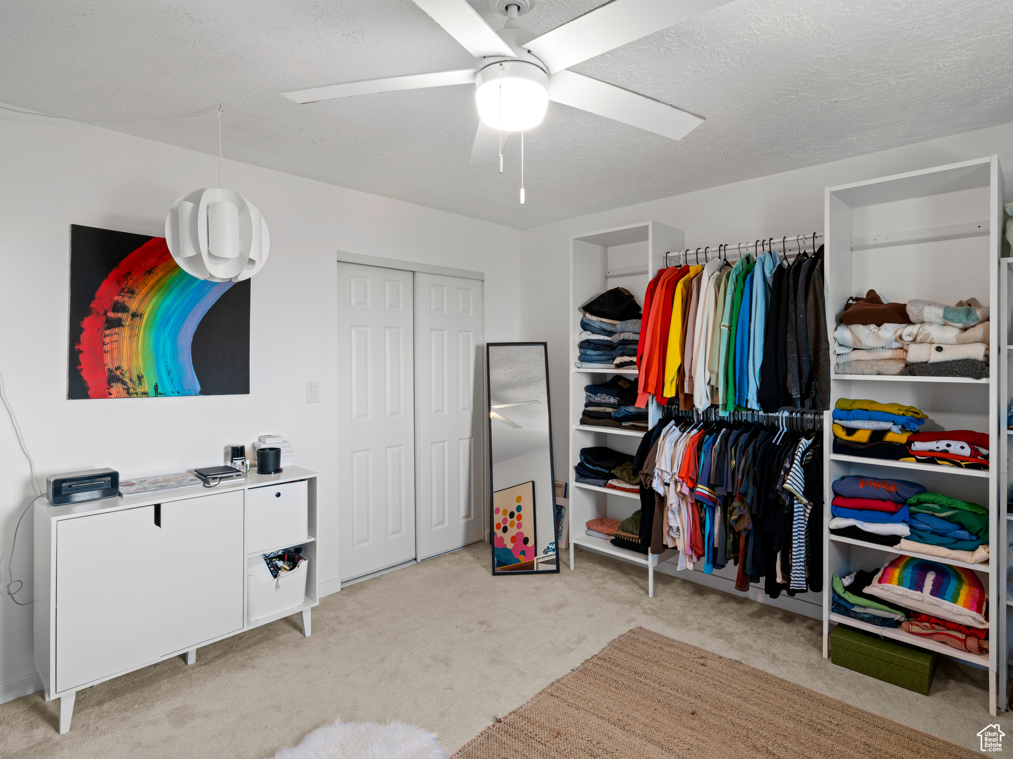 bedroom featuring ceiling fan and light colored carpet