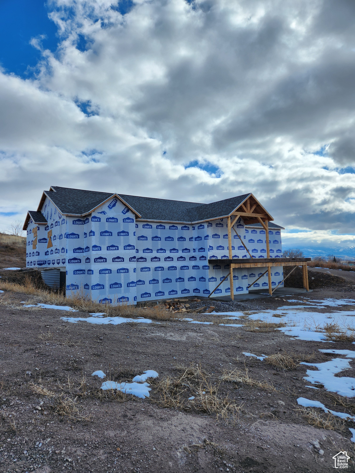 View of snow covered property