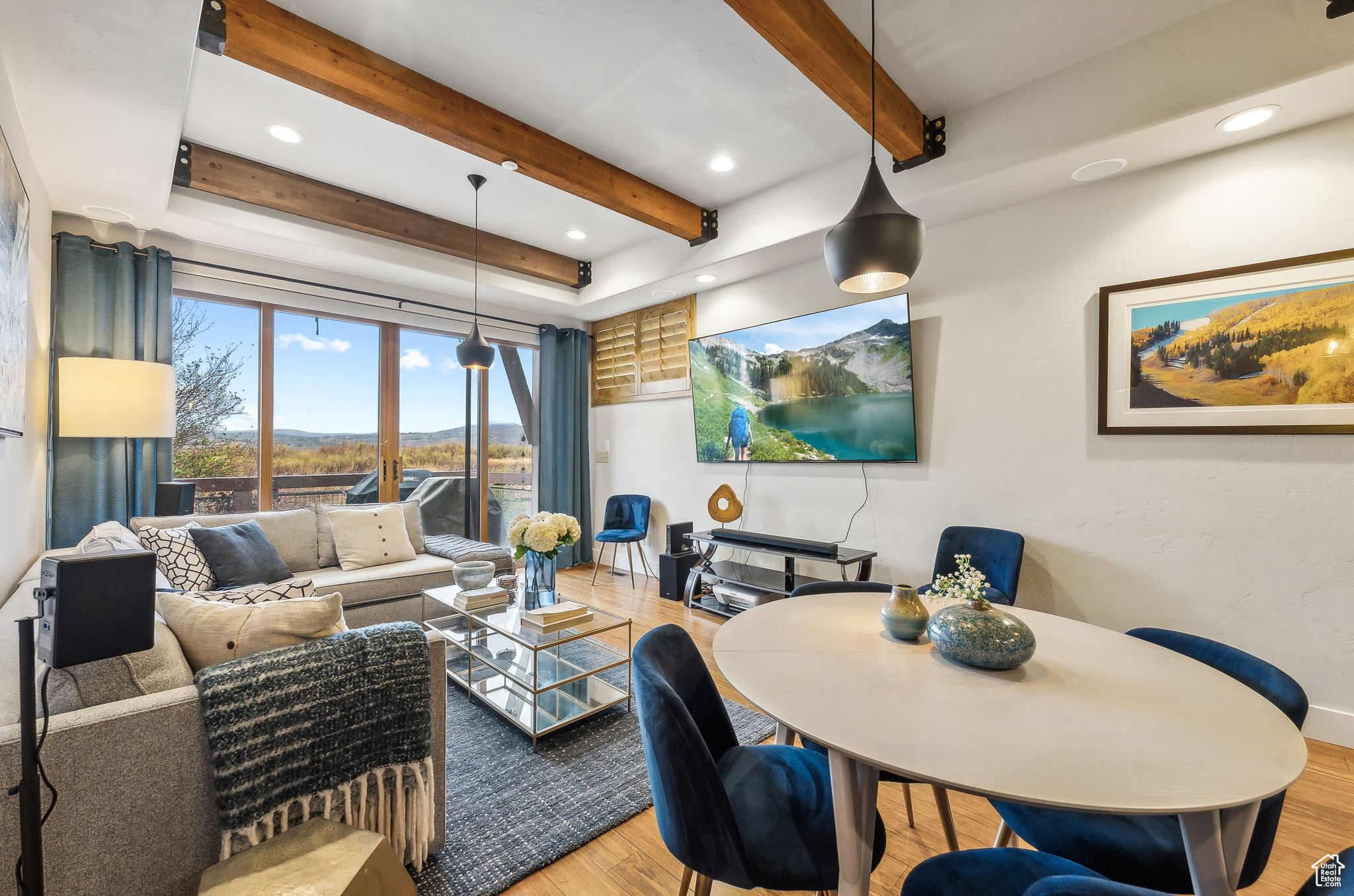 Living room featuring beamed ceiling, french doors, and hardwood / wood-style flooring