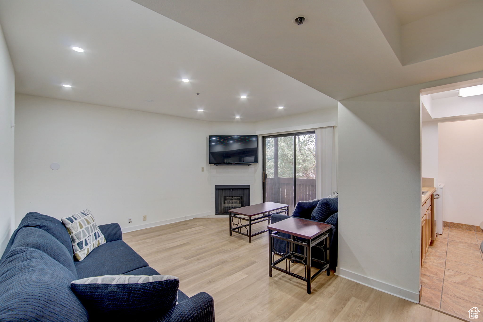 Living room with light hardwood / wood-style floors