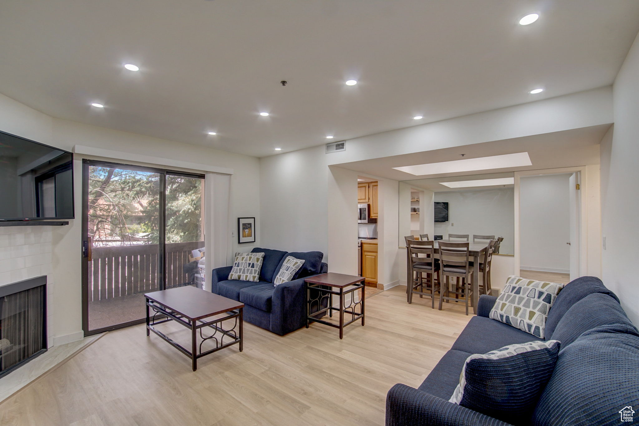 Living room featuring a fireplace and light hardwood / wood-style floors