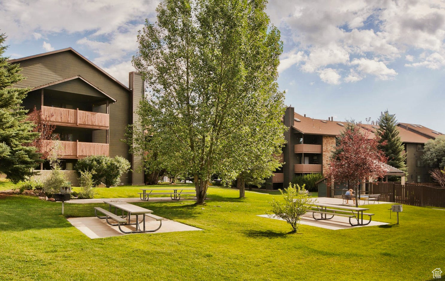 View of property's community with a yard