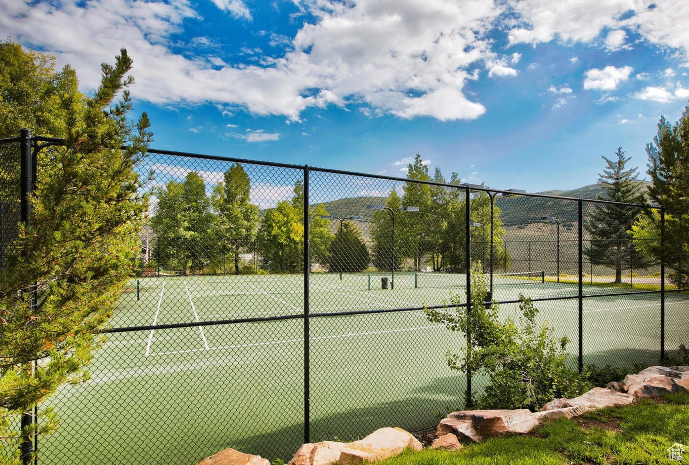 View of sport court with a mountain view