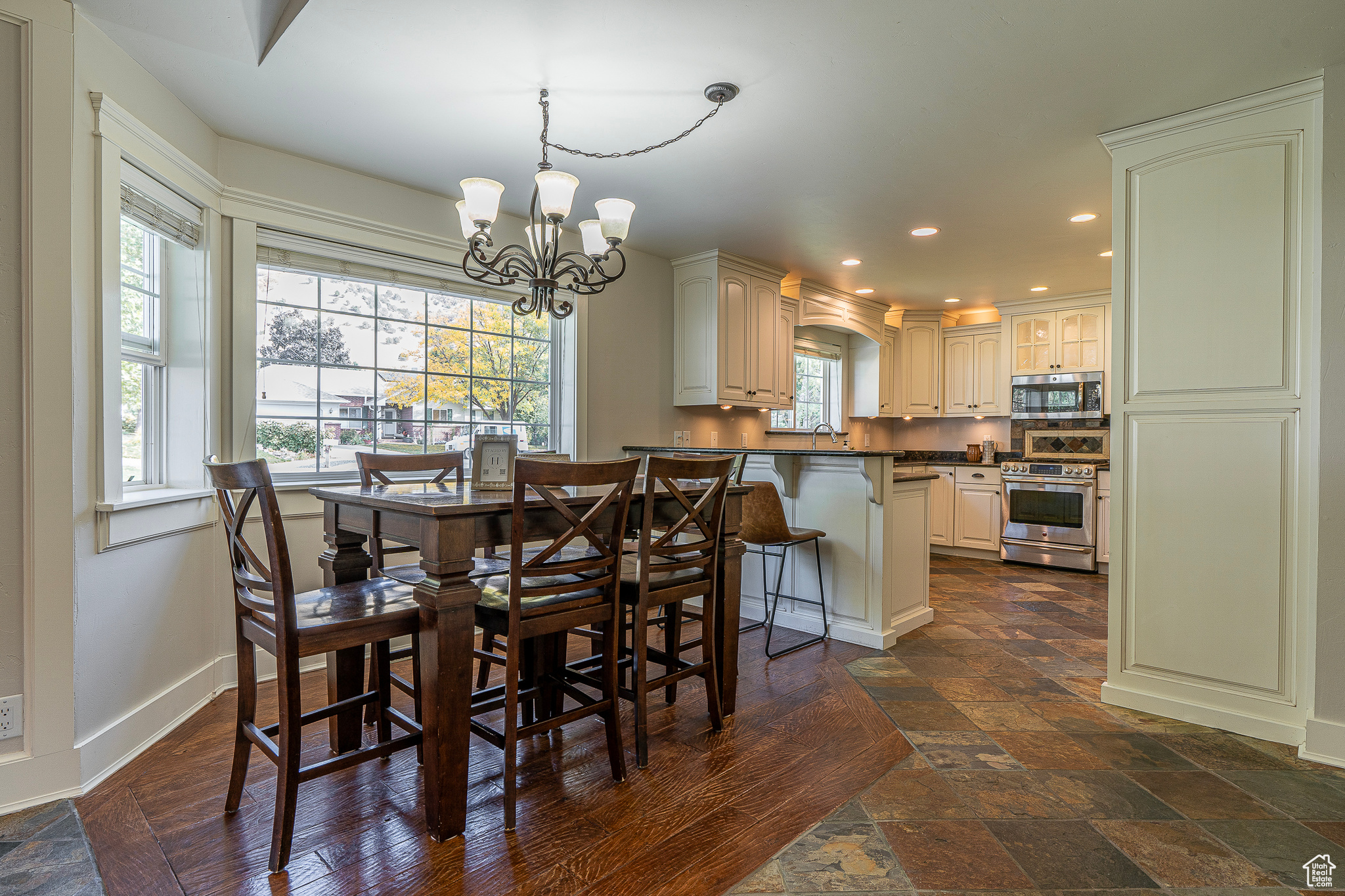 Dining room featuring sink and an inviting chandelier