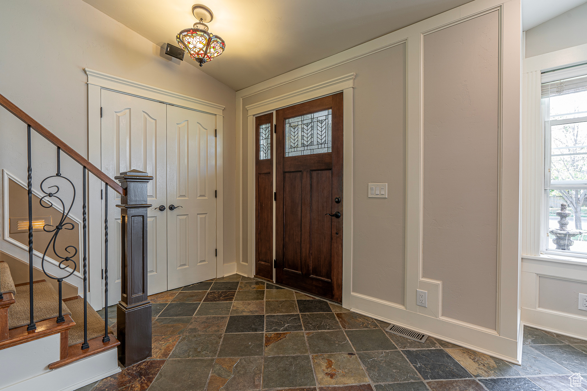 Entrance foyer featuring vaulted ceiling