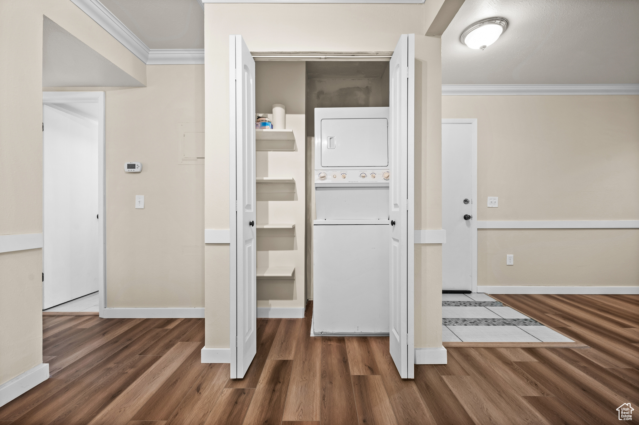 Closet featuring stacked washer / dryer