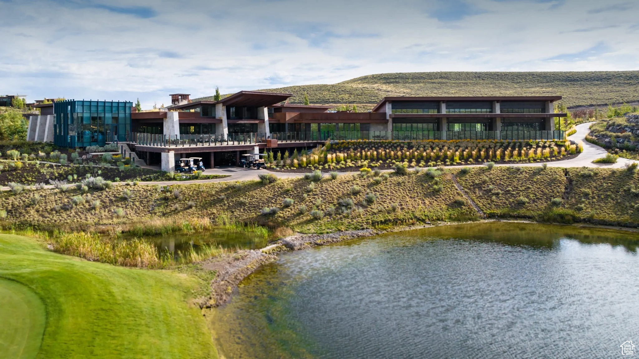 Back of house with a water view