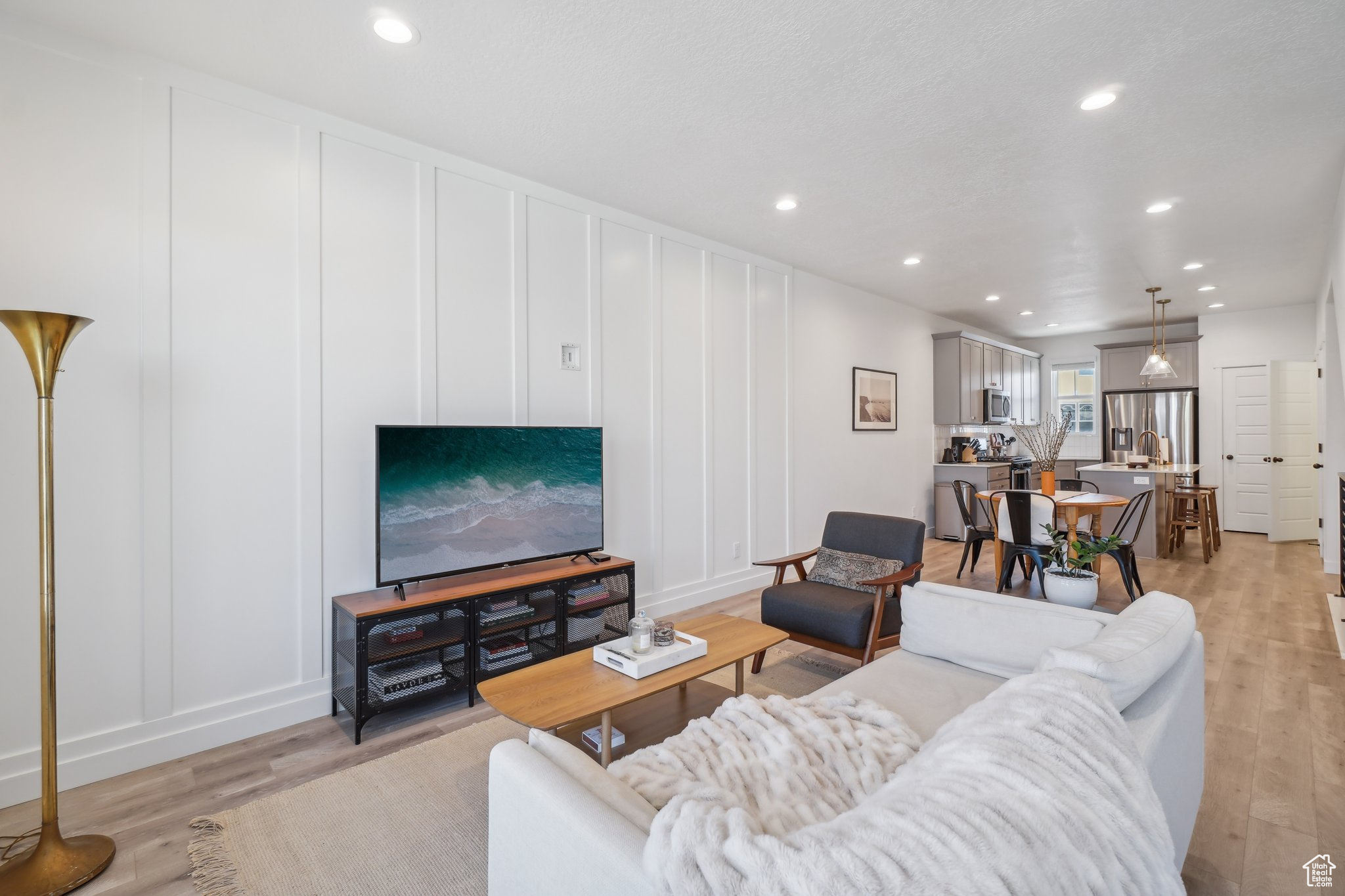 Living room with light hardwood / wood-style flooring