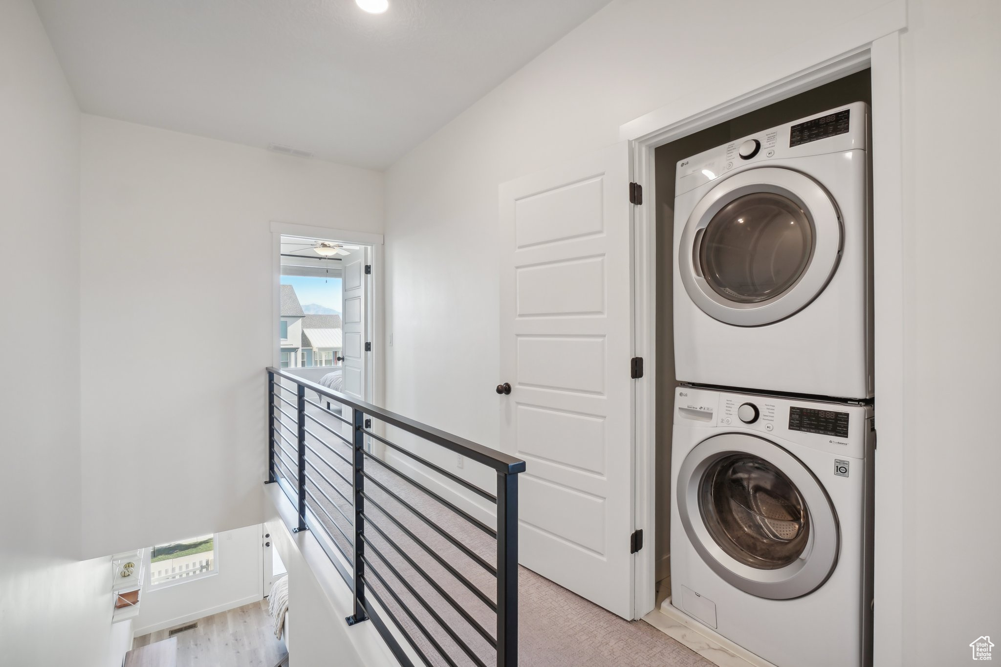 Laundry area with stacked washer / dryer