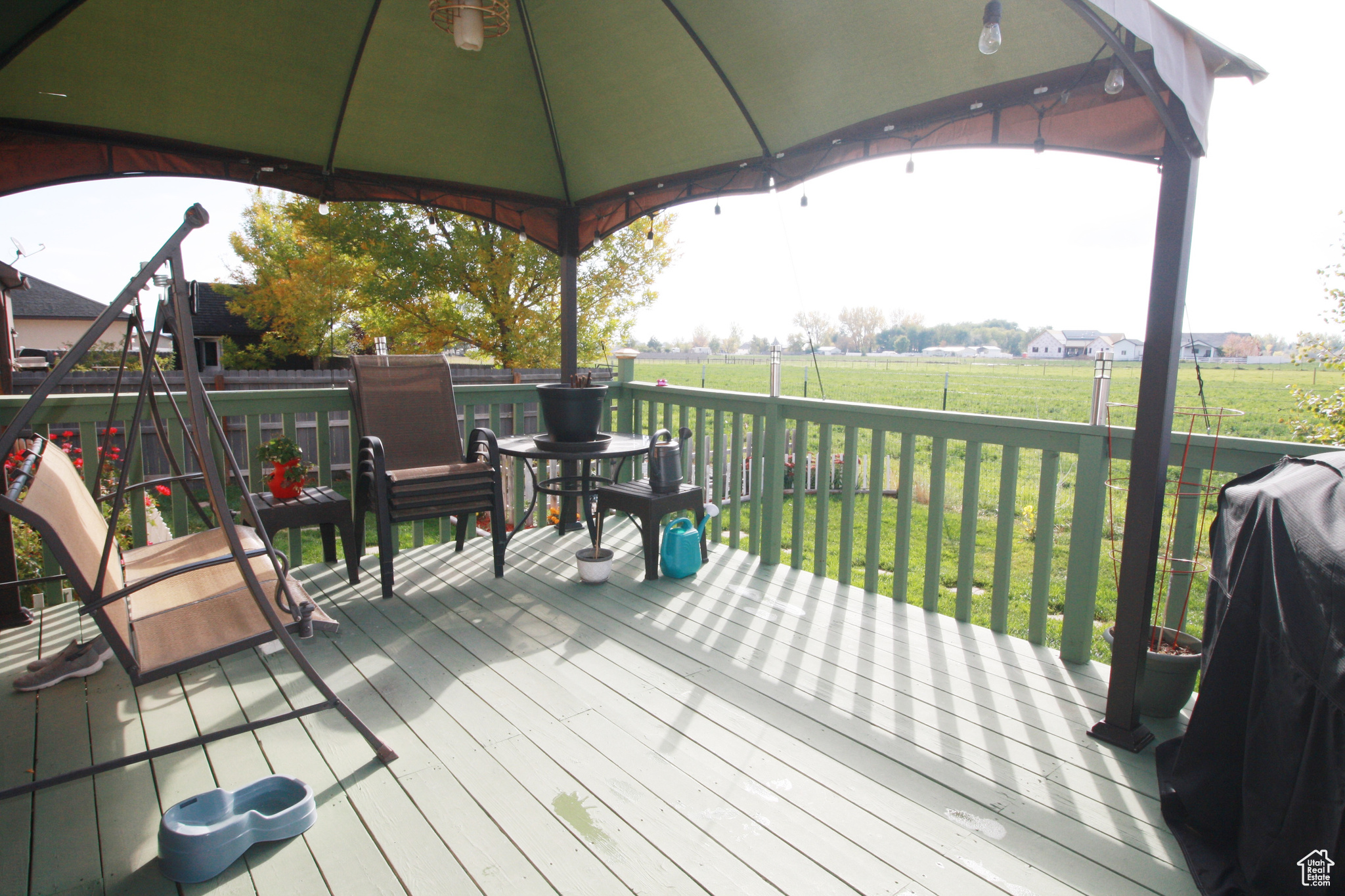 Deck featuring a gazebo and a yard