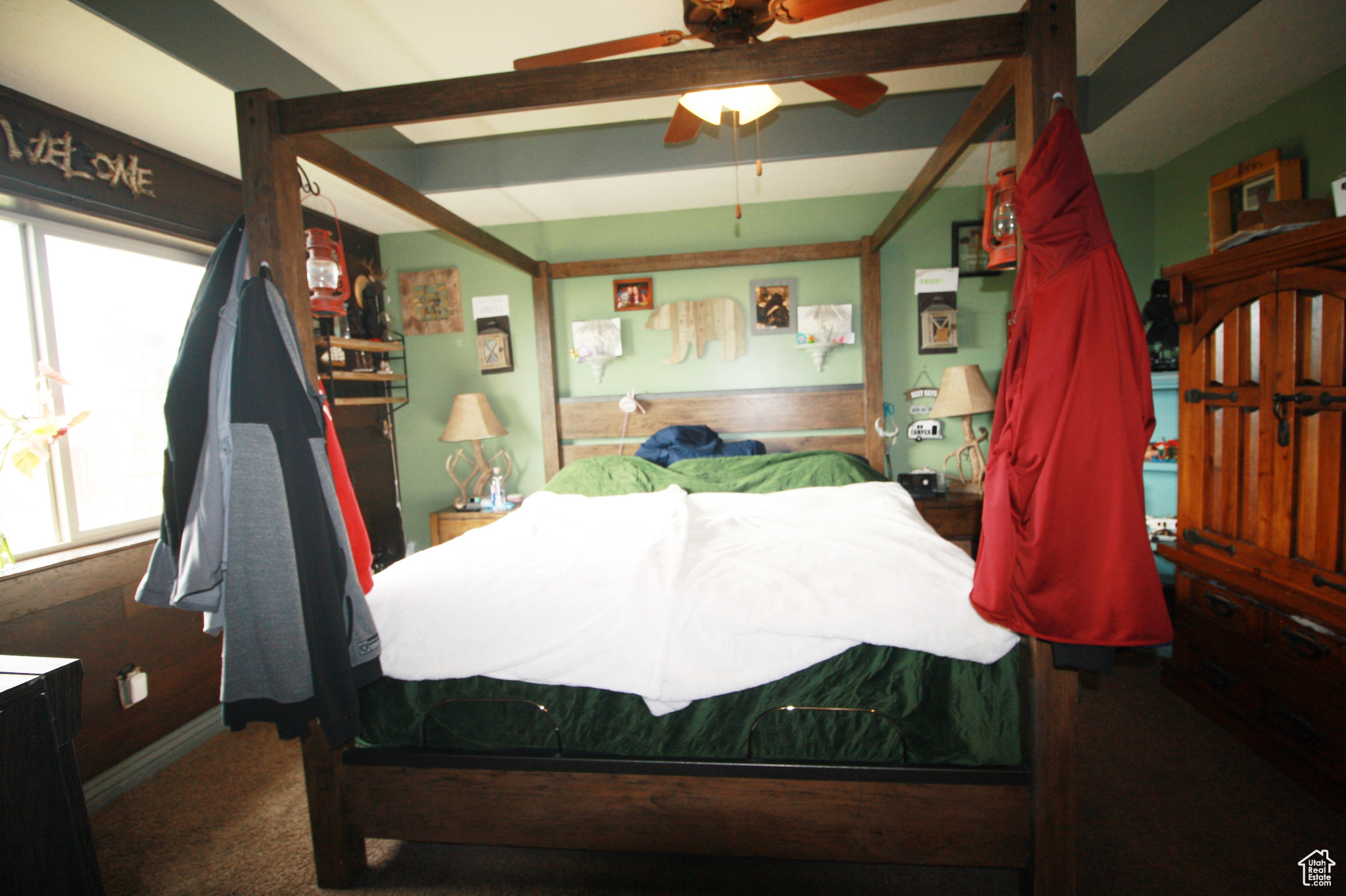 Carpeted  Master bedroom with ceiling fan