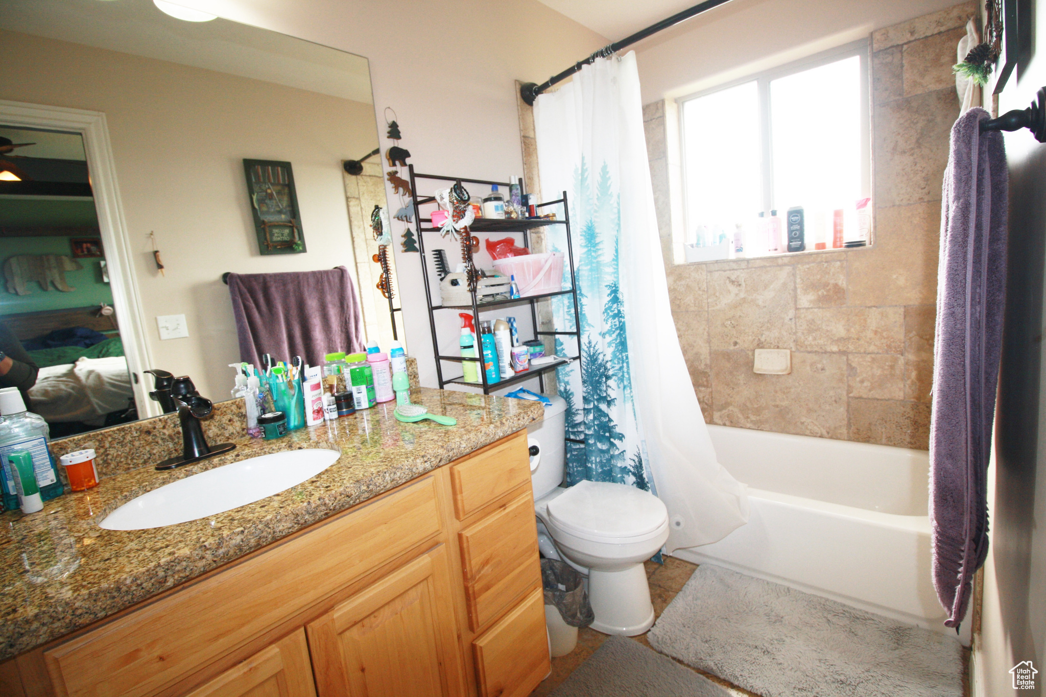 Full Master bathroom featuring vanity, shower / tub combo, and toilet