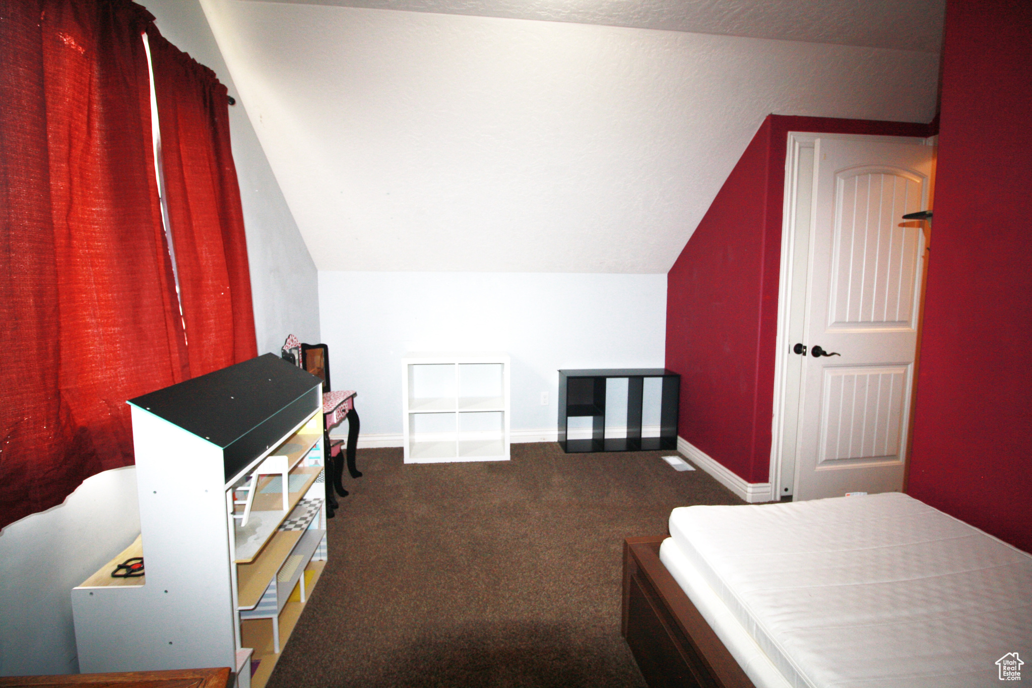 Carpeted bedroom 4, featuring vaulted ceiling