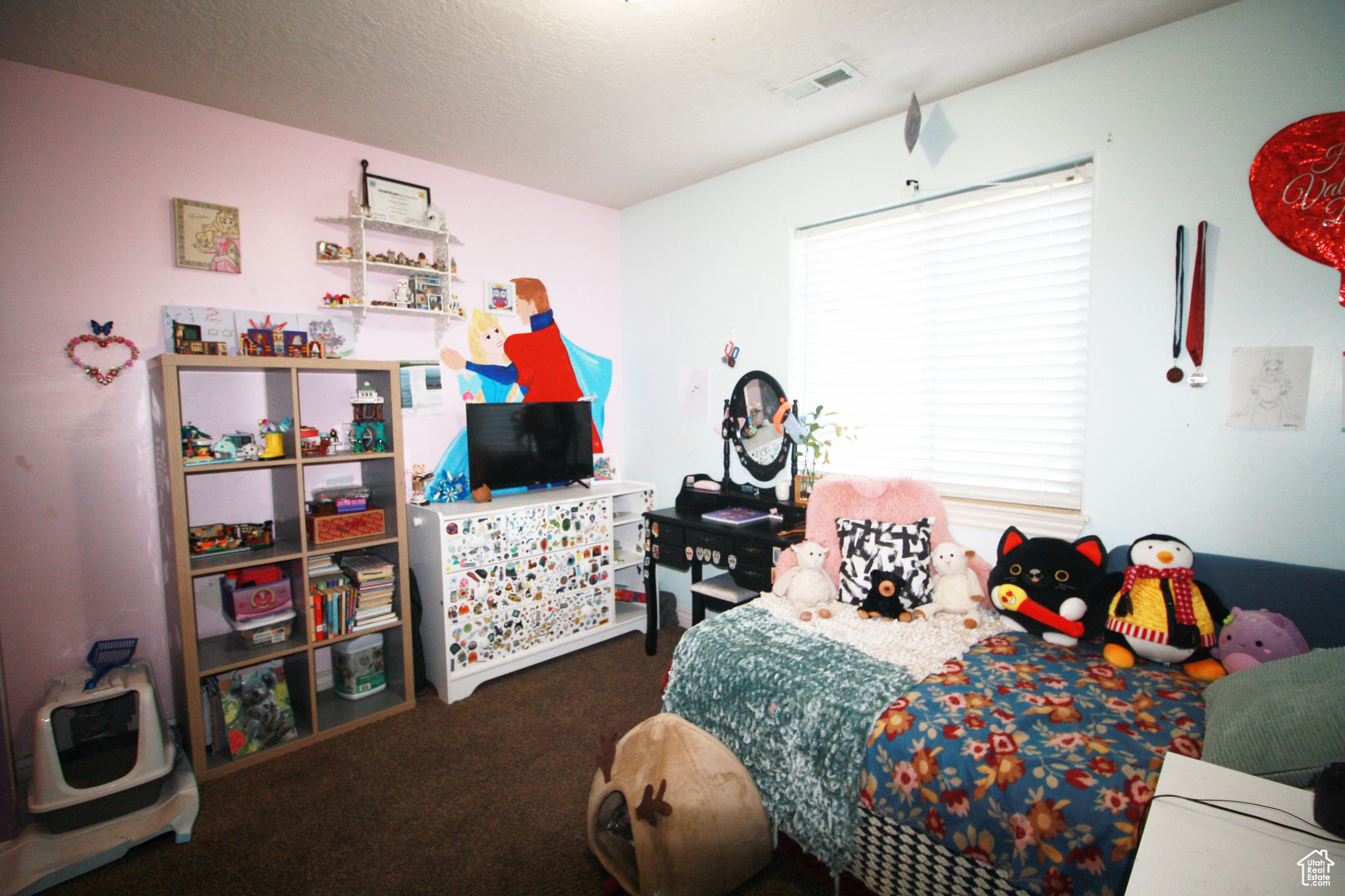 Bedroom 3, with a textured ceiling and dark colored carpet