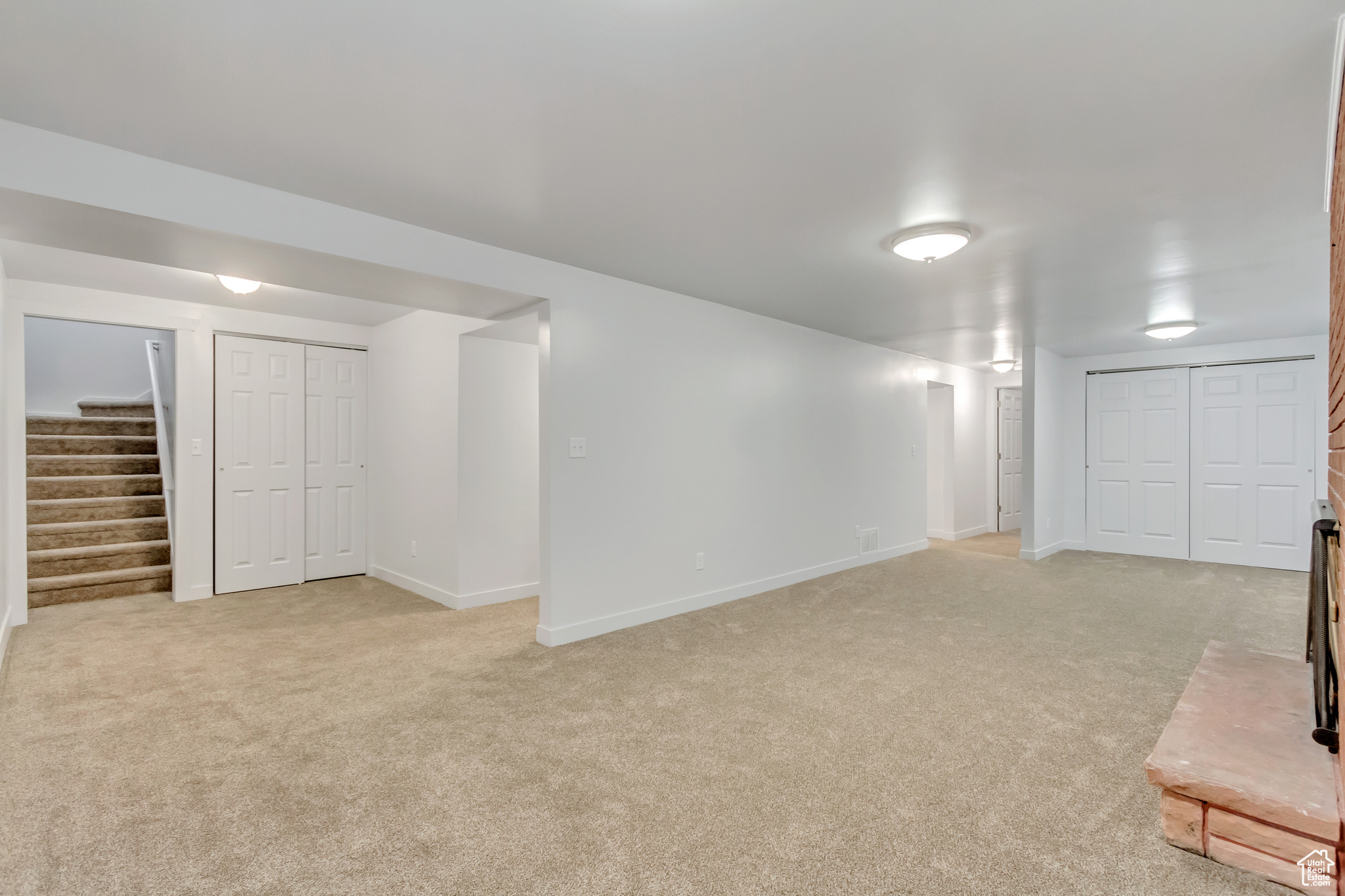 Basement with light carpet