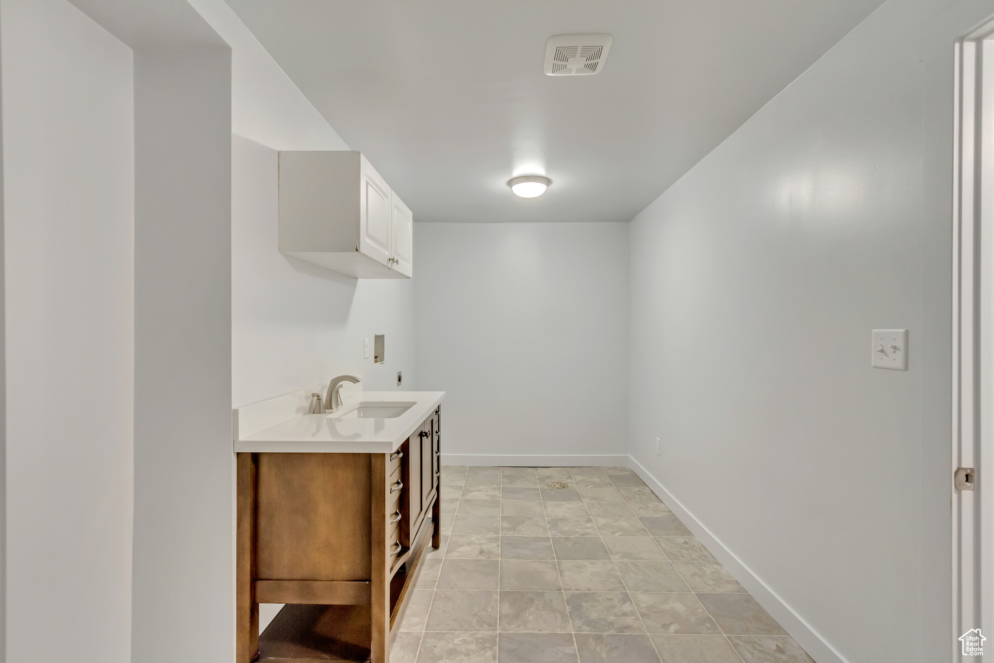 Interior space featuring sink and washer hookup