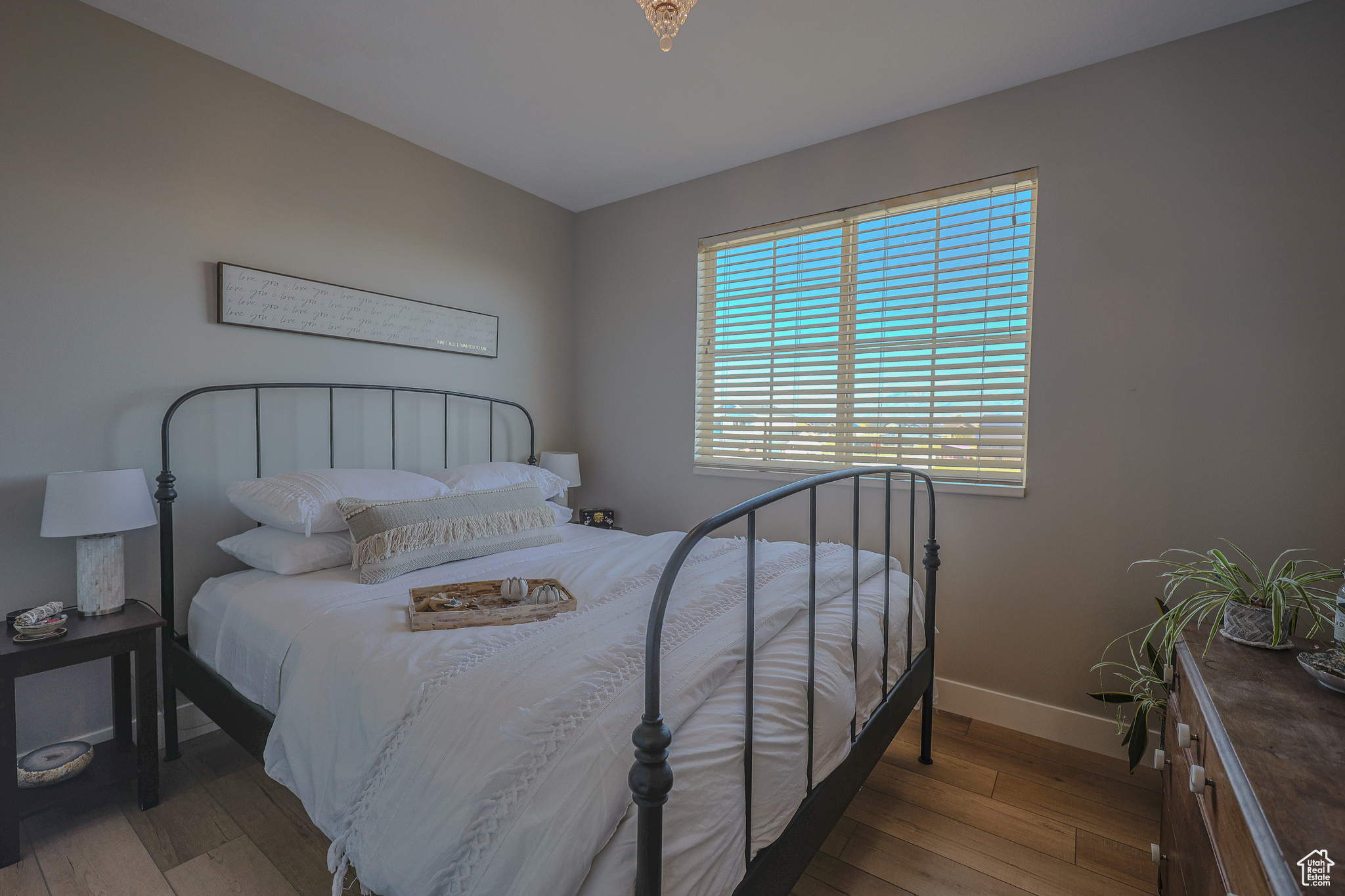 Bedroom with light hardwood / wood-style flooring