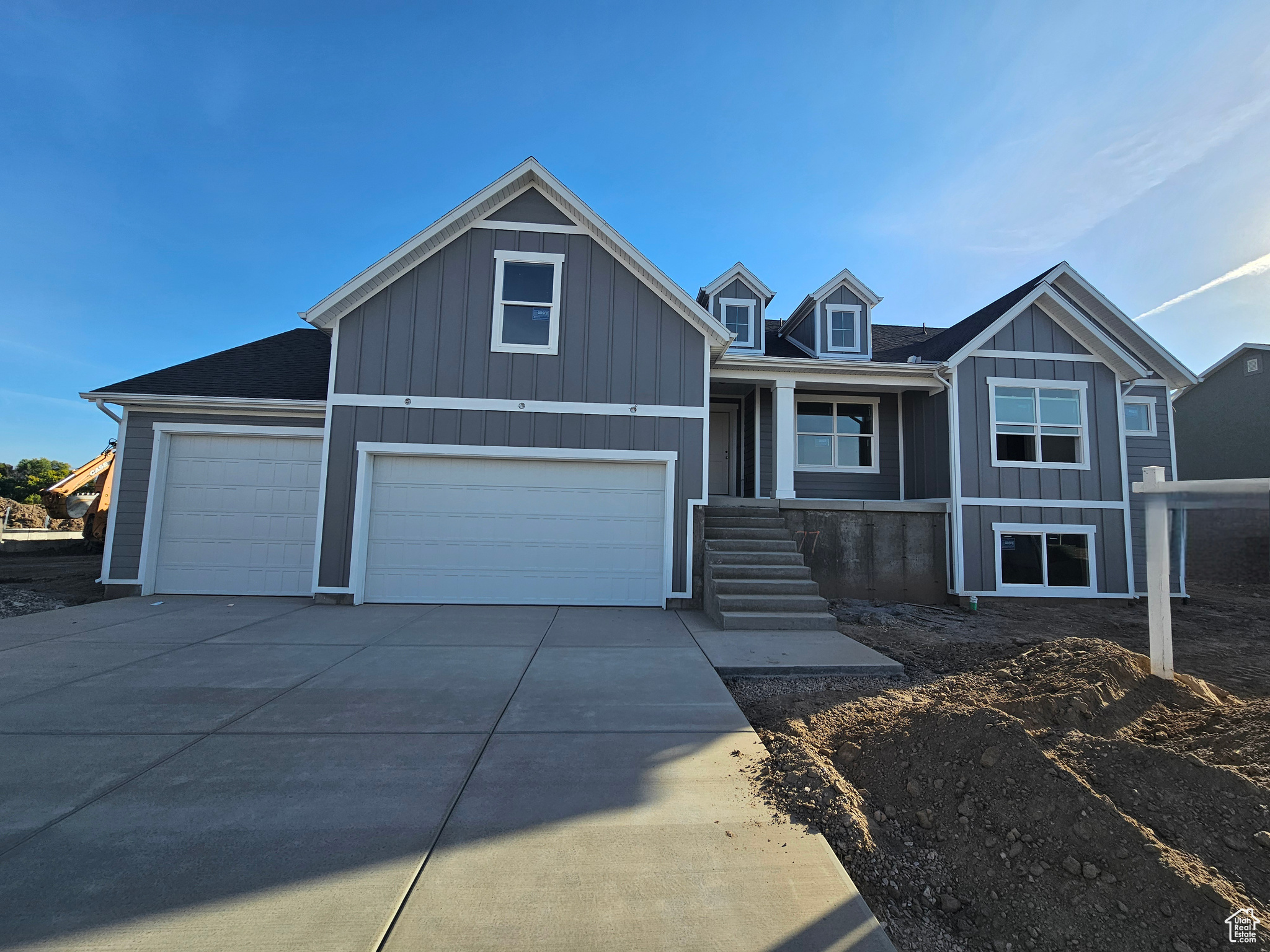 View of front of property with a garage