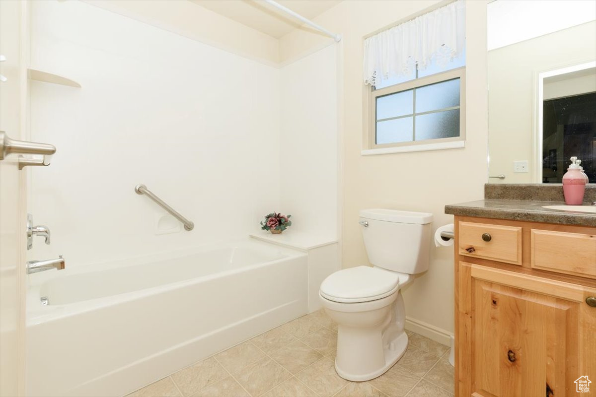 Full bathroom with vanity, toilet, and tub / shower combination