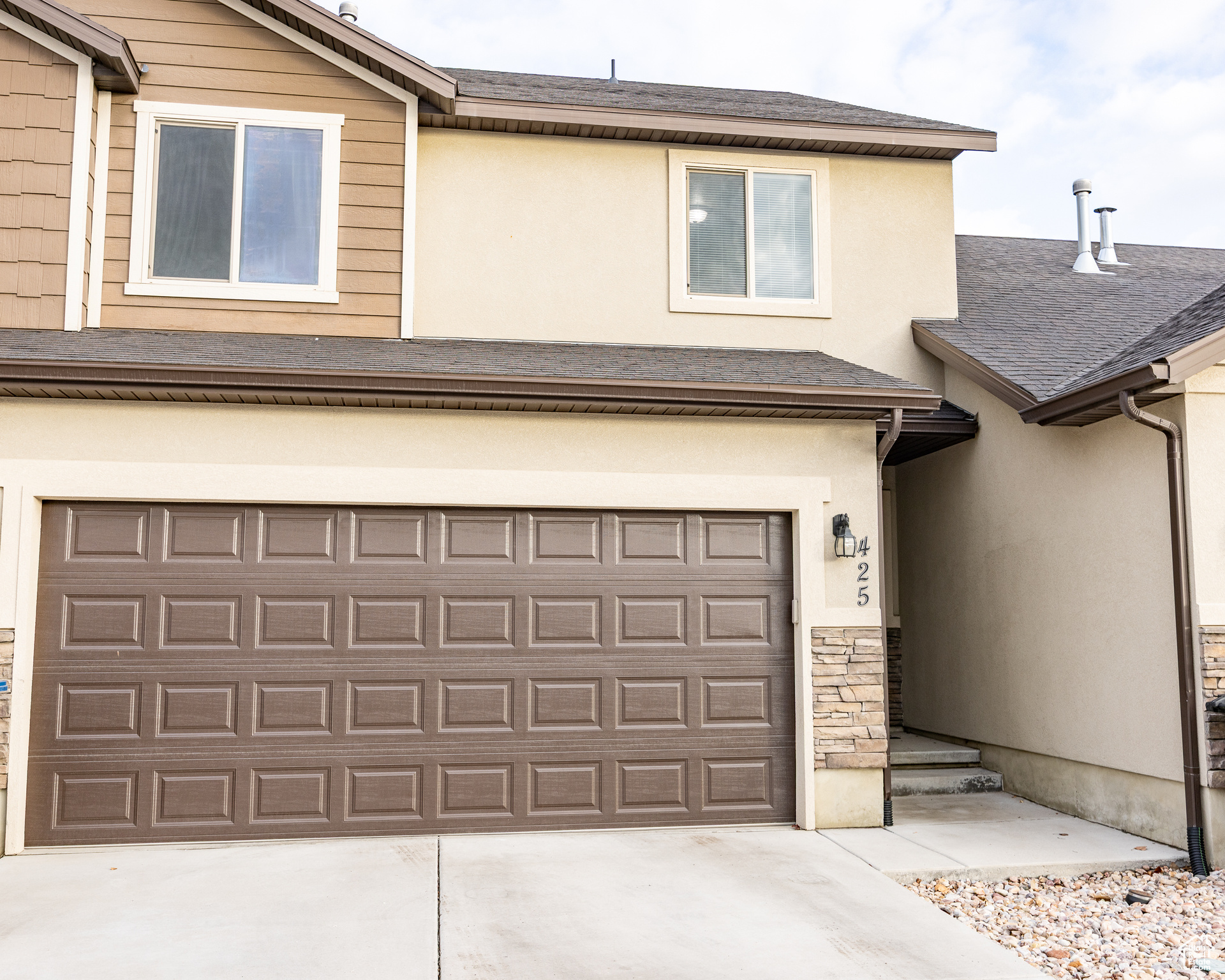 Garage featuring driveway