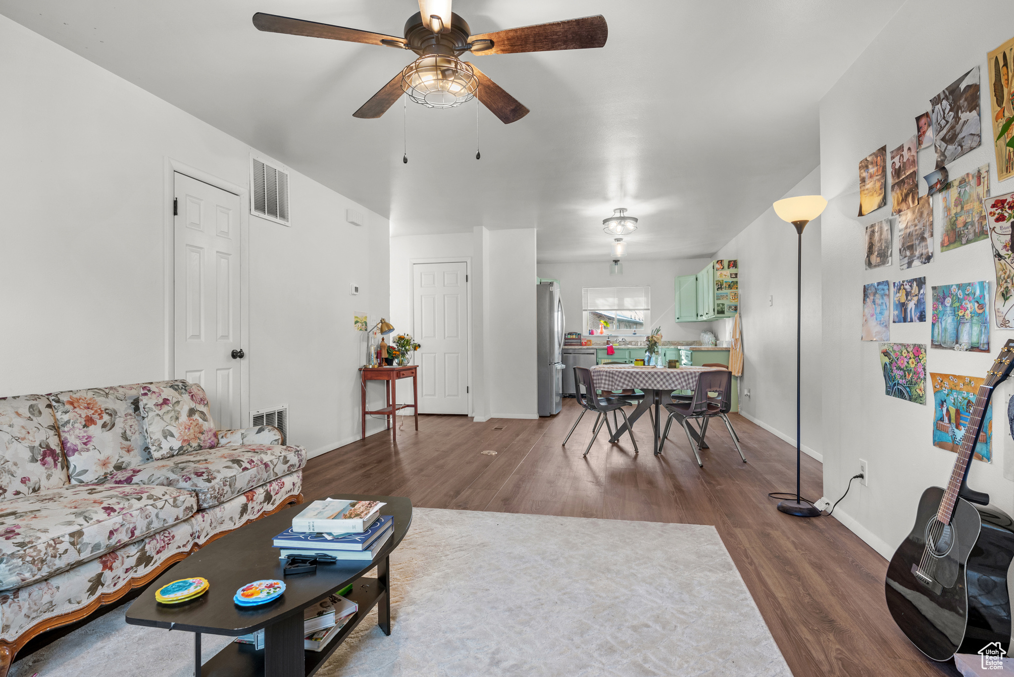 Living room featuring hardwood / wood-style floors and ceiling fan