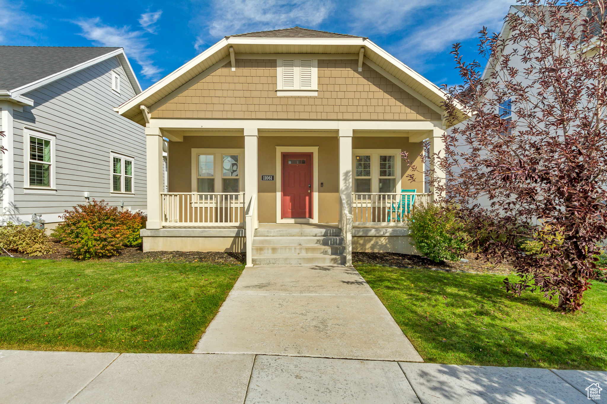 Bungalow-style house with a front yard and a porch