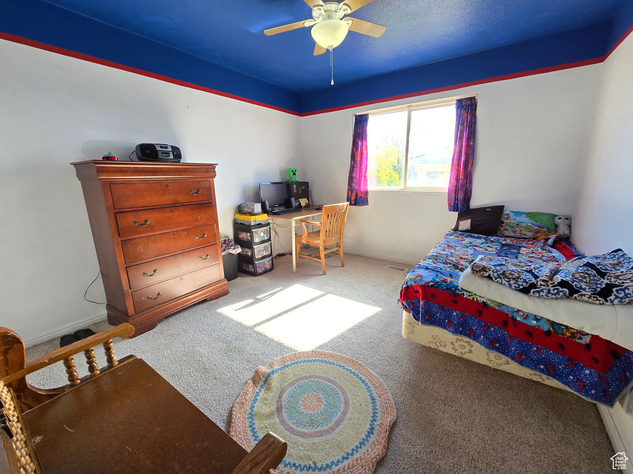 Bedroom with carpet floors and ceiling fan