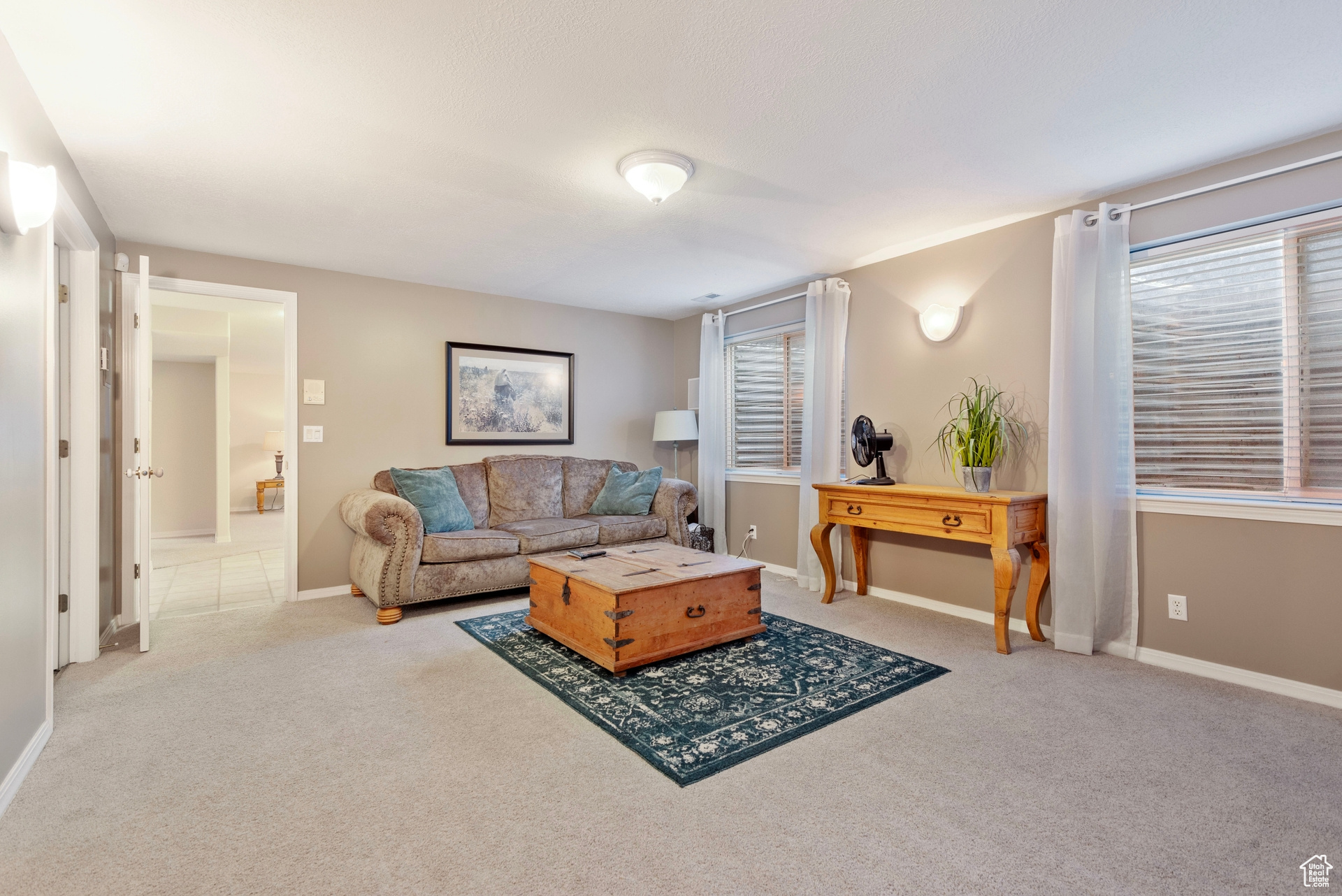 Living room with light colored carpet