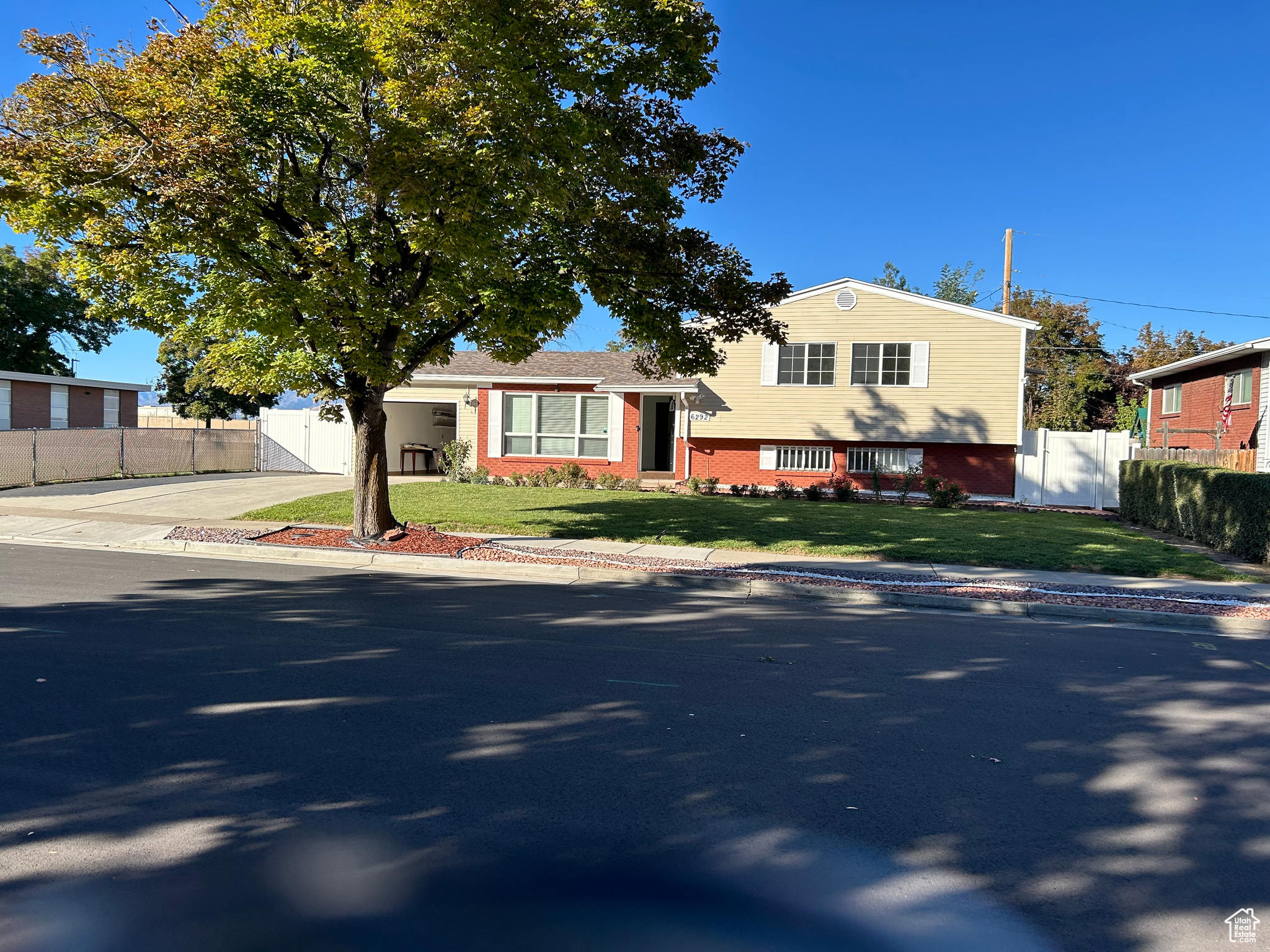 Tri-level home with a front lawn