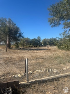 View of yard with a rural view