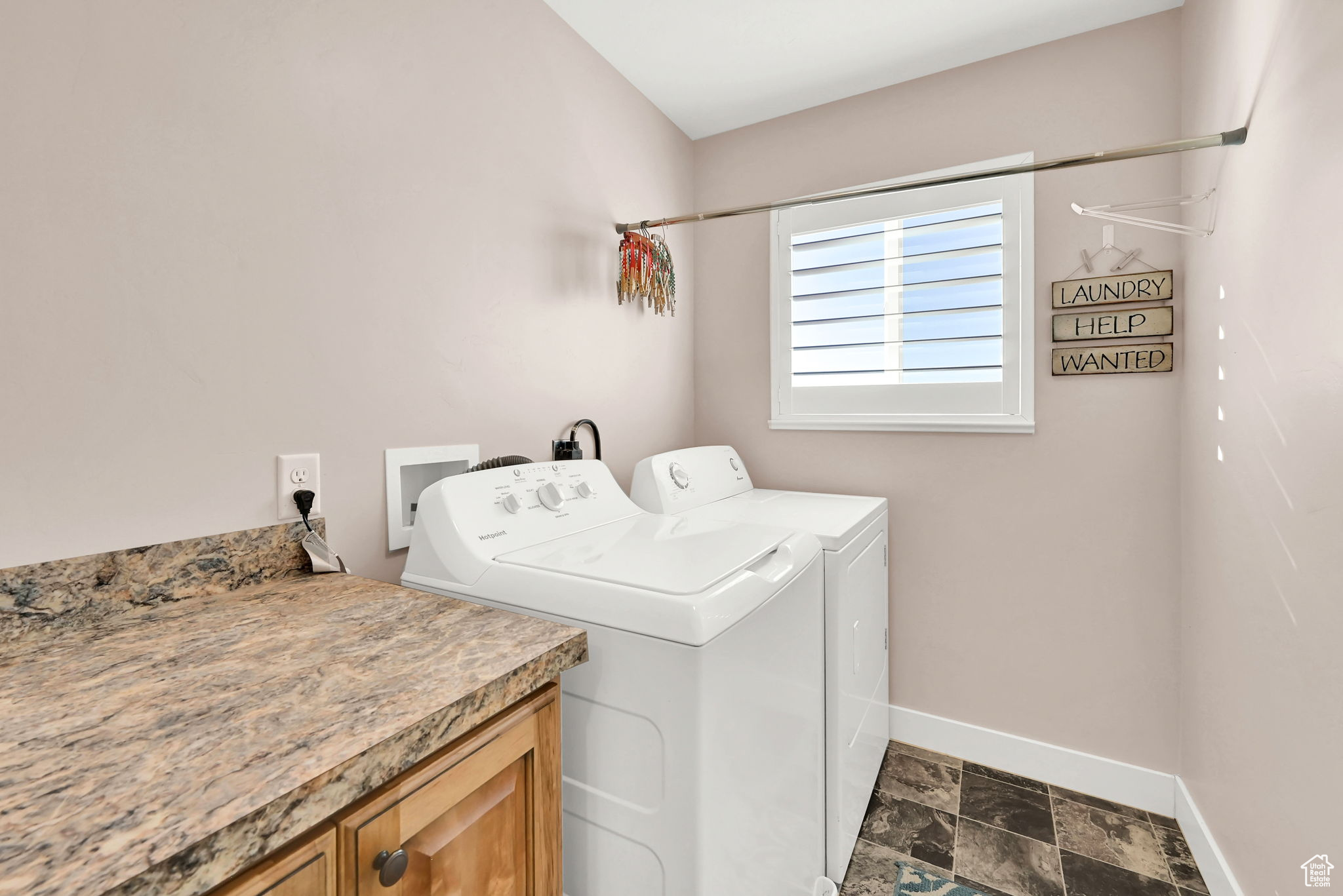 Laundry area with washing machine and dryer and cabinets