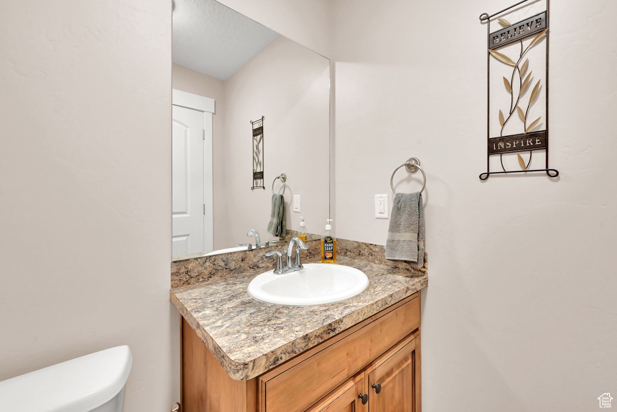 Bathroom with vanity and toilet