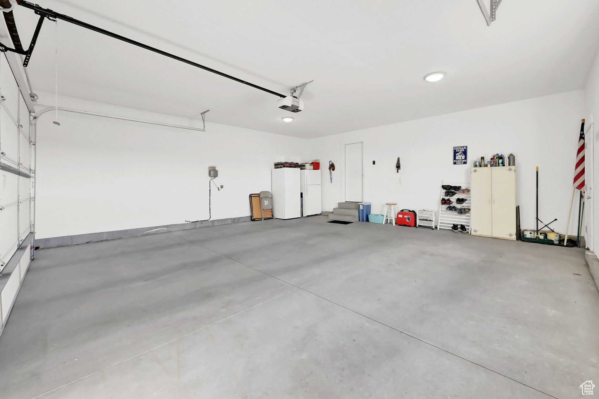 Garage featuring a garage door opener