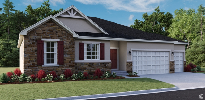 View of front of home featuring a garage and a front lawn