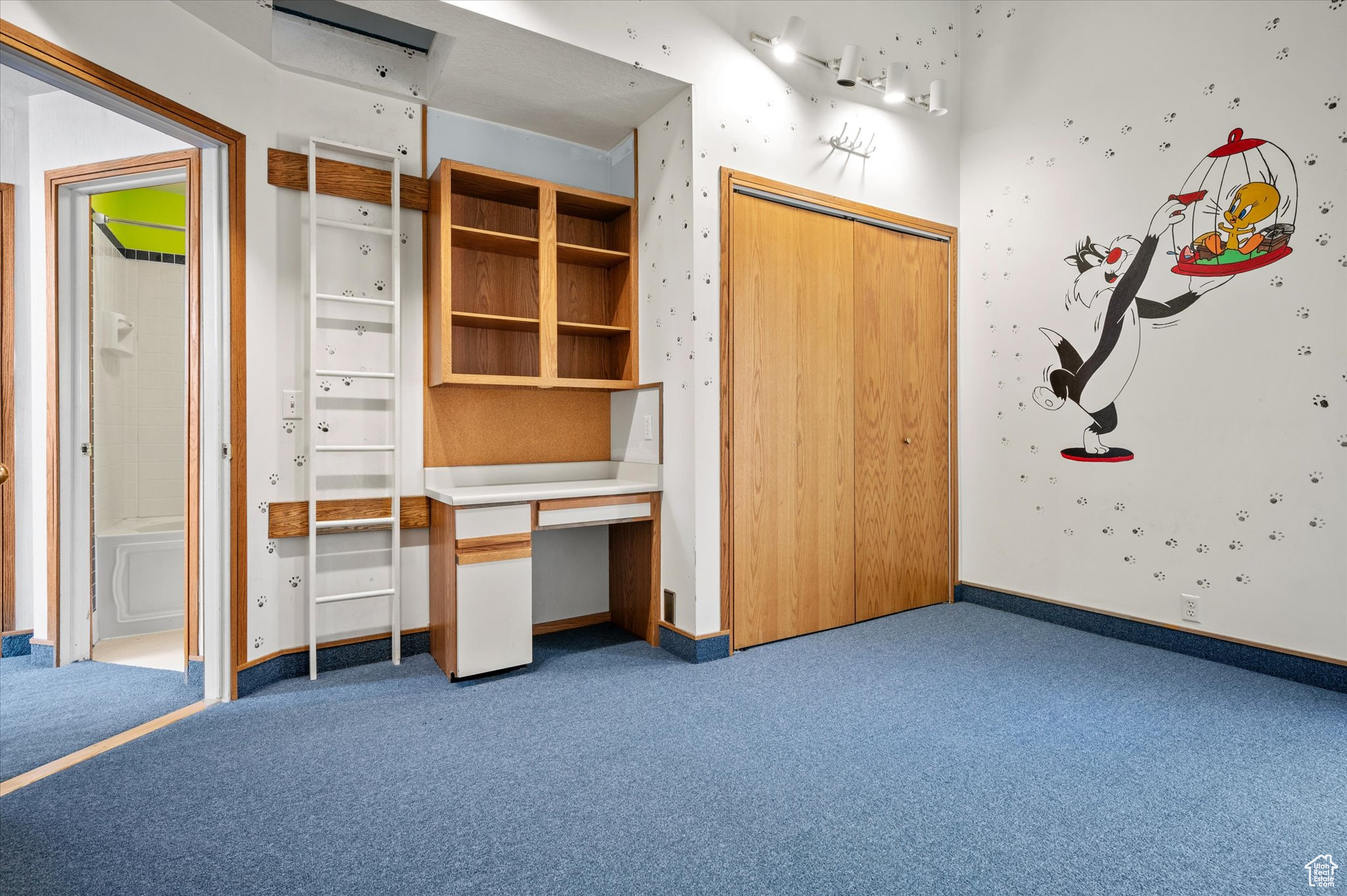 Bedroom with built in desk.