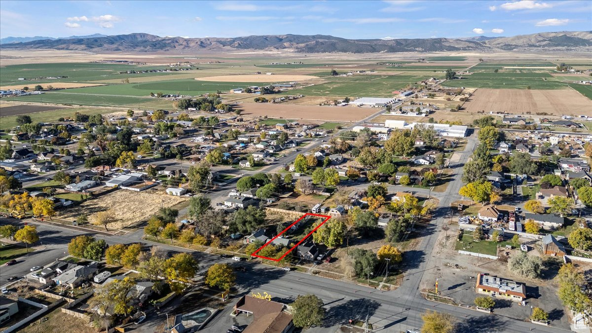 Birds eye view of property with a mountain view