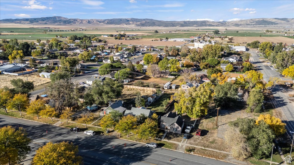 Birds eye view of property with a mountain view