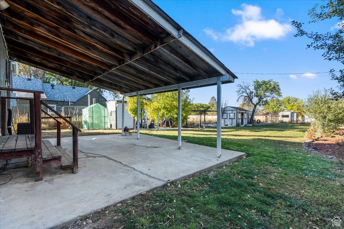 View of patio / terrace featuring a storage unit