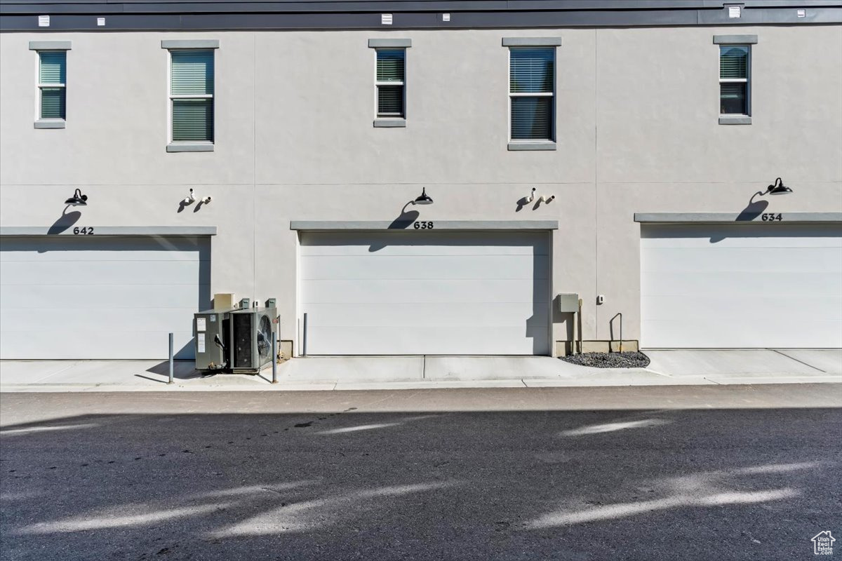 Rear view of house featuring a double garage