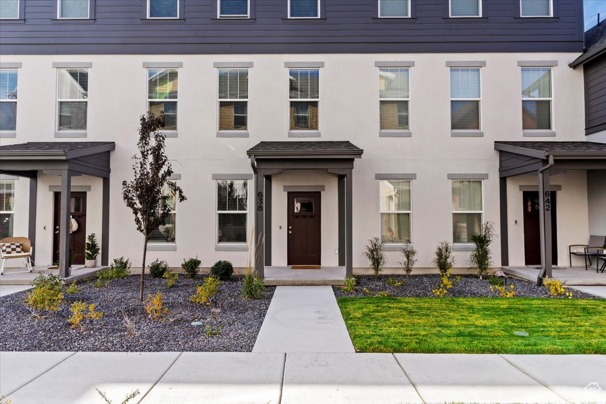 View of front of property with a front yard