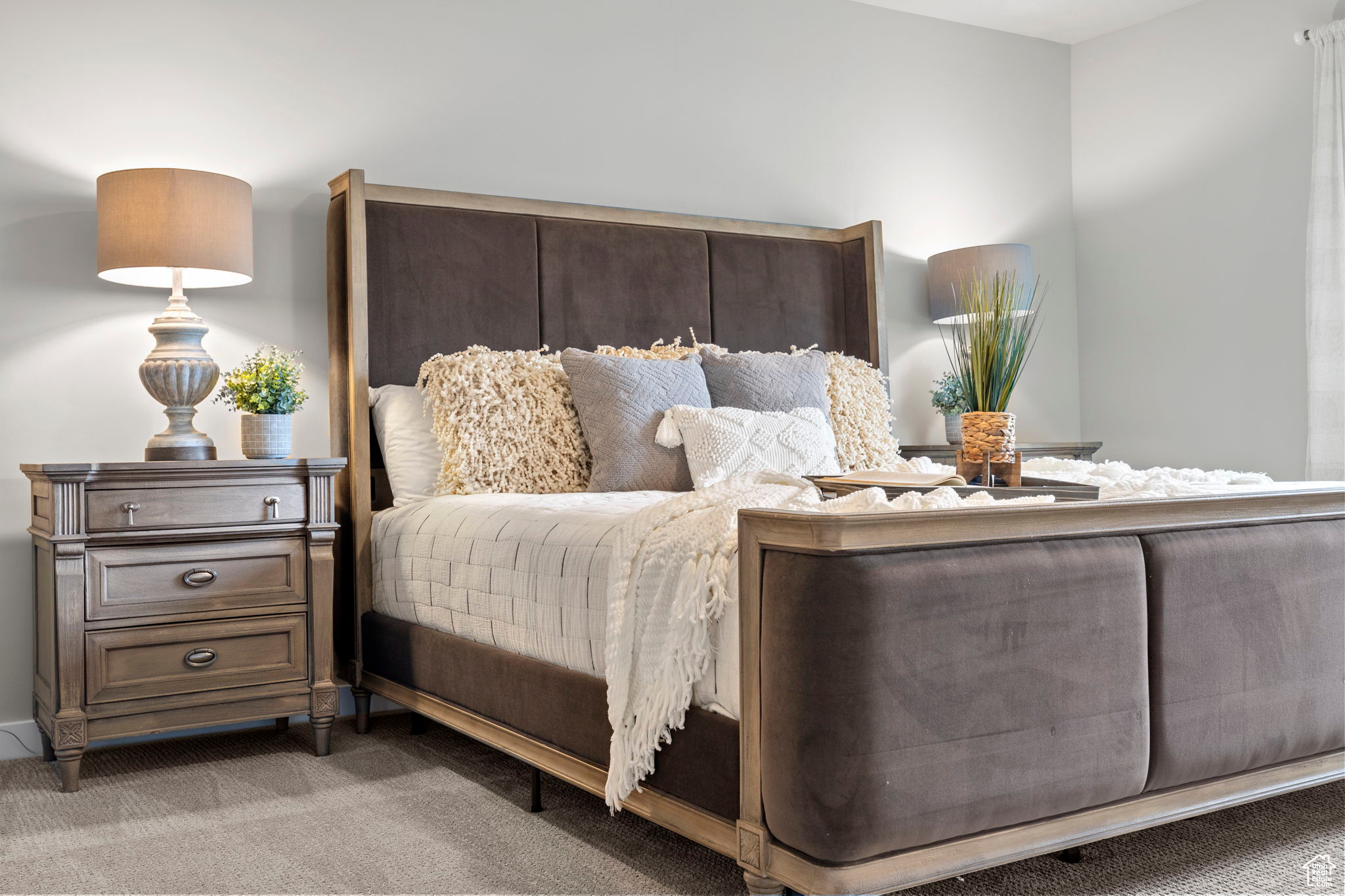 Bedroom featuring light carpet