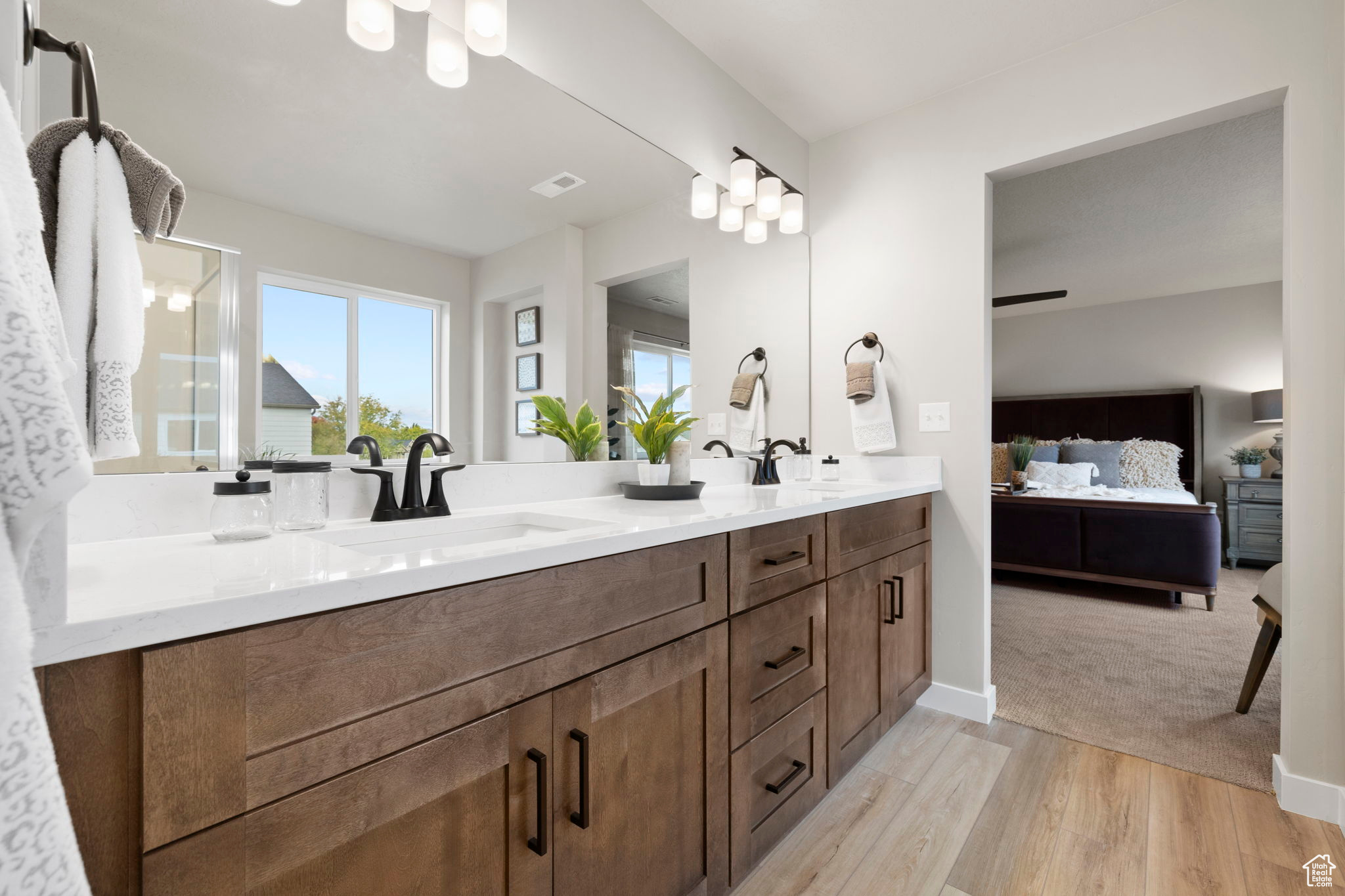 Bathroom featuring vanity and wood-type flooring