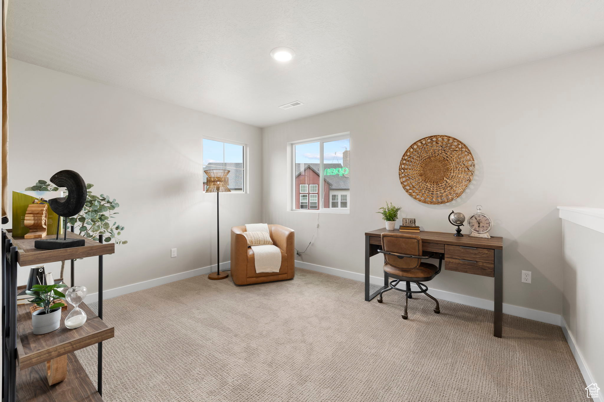 Home office with light colored carpet