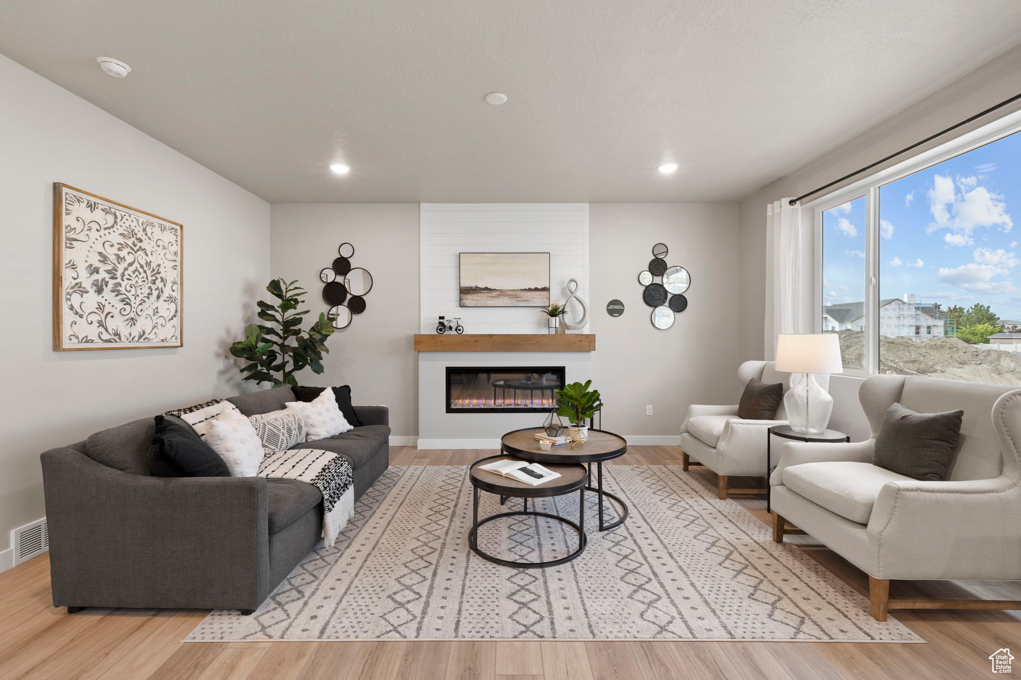 Living room with light hardwood / wood-style floors