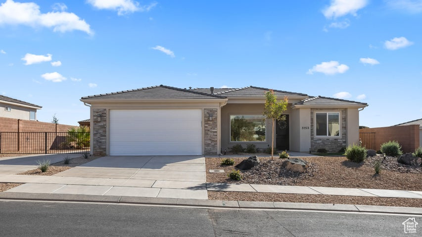 View of front of home featuring a garage